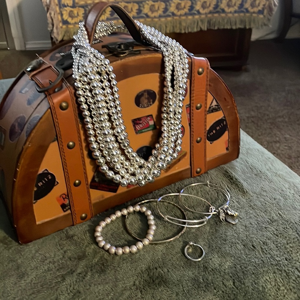 A Small Bundle Of Silver color Jewelry
